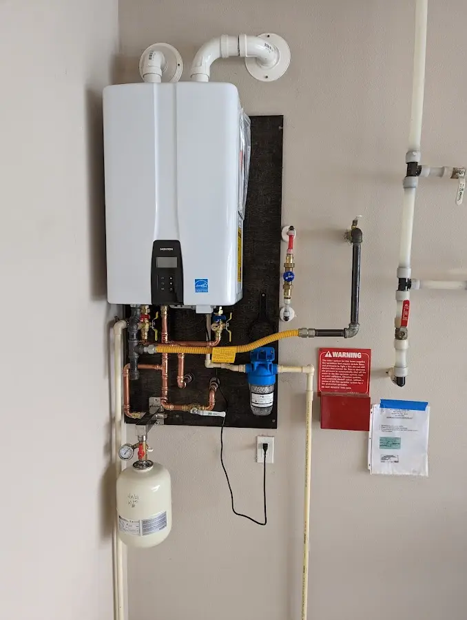 Professional plumber installing copper piping in a Universal City home